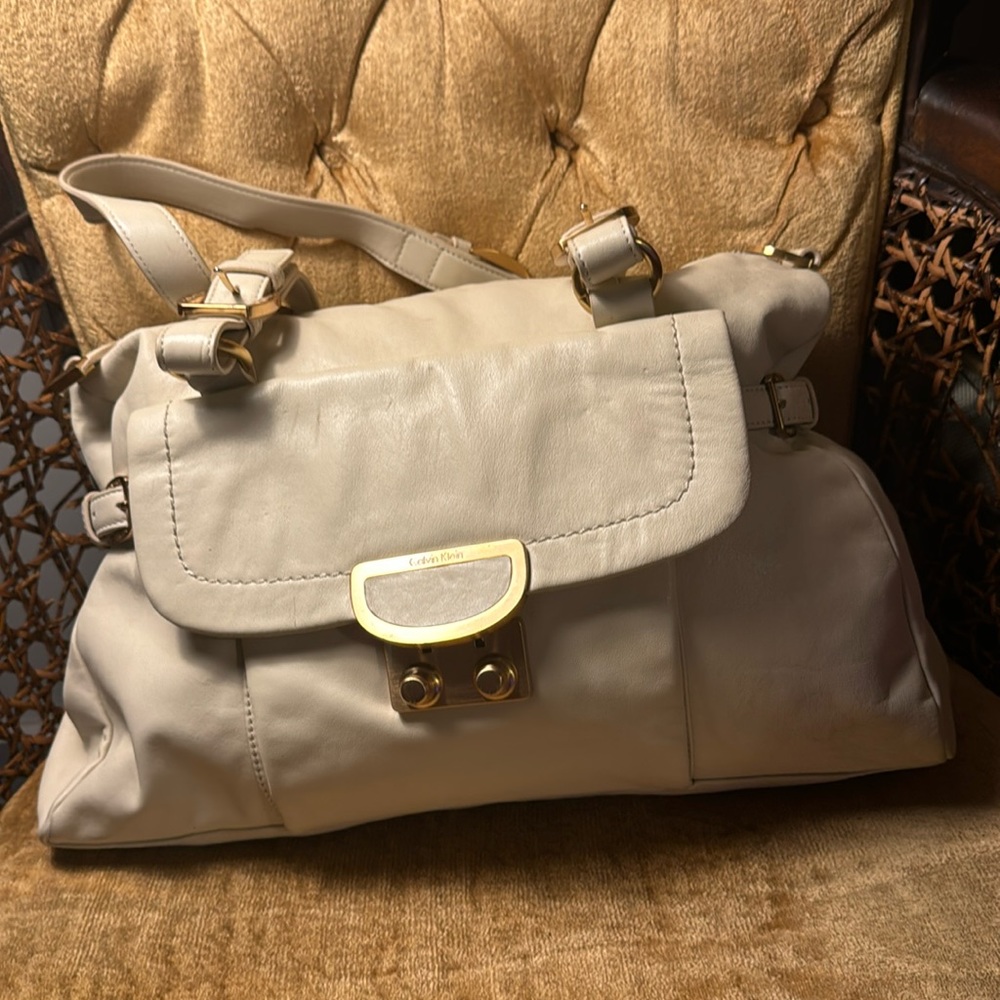 Calvin Klein, beige and gold show there are handbag
